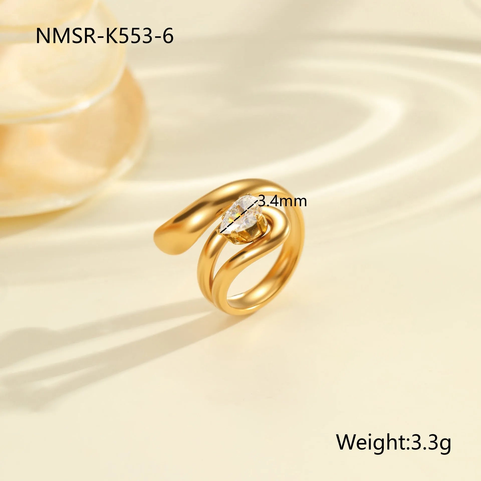 Geometric zircon ring showing round, oval and quadrangular design elements in stainless steel with electroplated finish