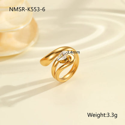 Geometric zircon ring showing round, oval and quadrangular design elements in stainless steel with electroplated finish
