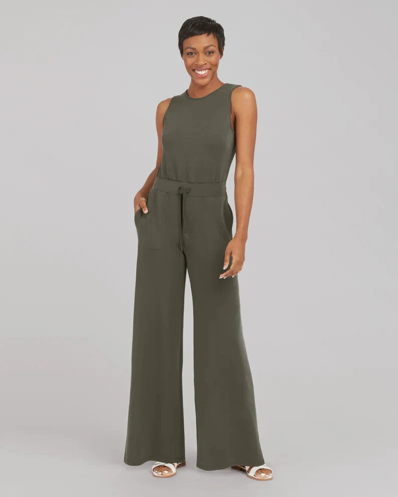 Women's lace-up jumpsuit pants in polyester, available in multiple colors and sizes for adjustable fit.