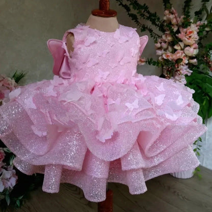 Pink sleeveless girls' dress with three-dimensional butterfly decoration on front
