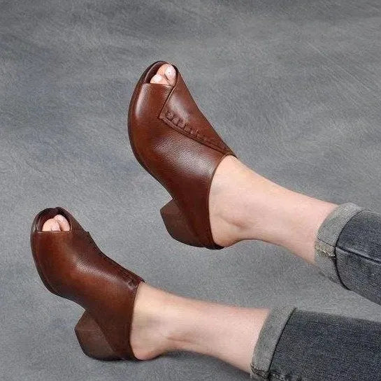 Women's black square heel peep toe slippers with a fish mouth scaffold design and rubber sole.