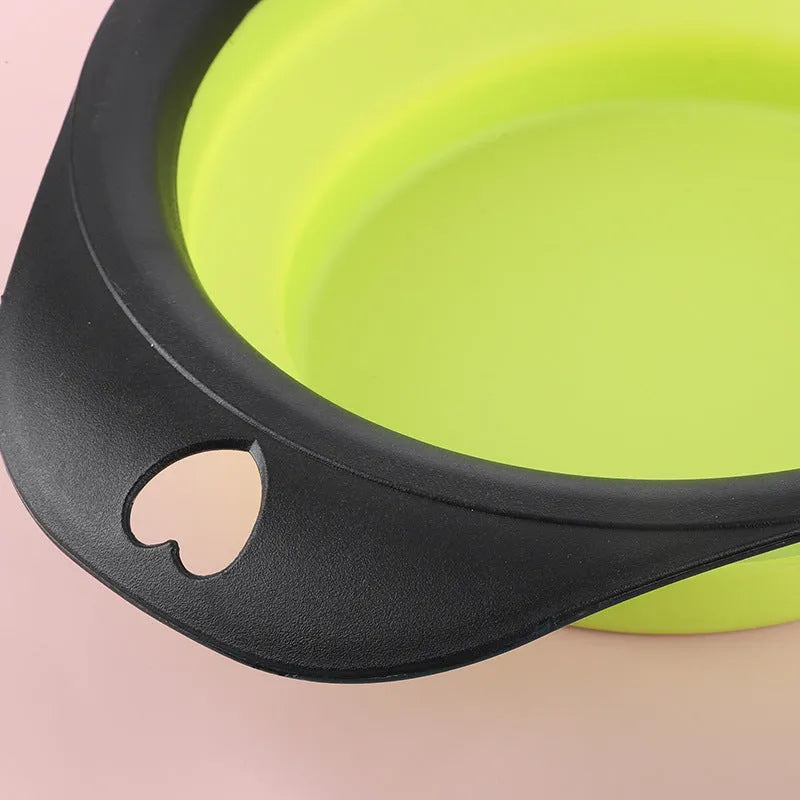 Collapsible silicone pet food bowl shown folded flat and unfolded, in green colour with non-slip base