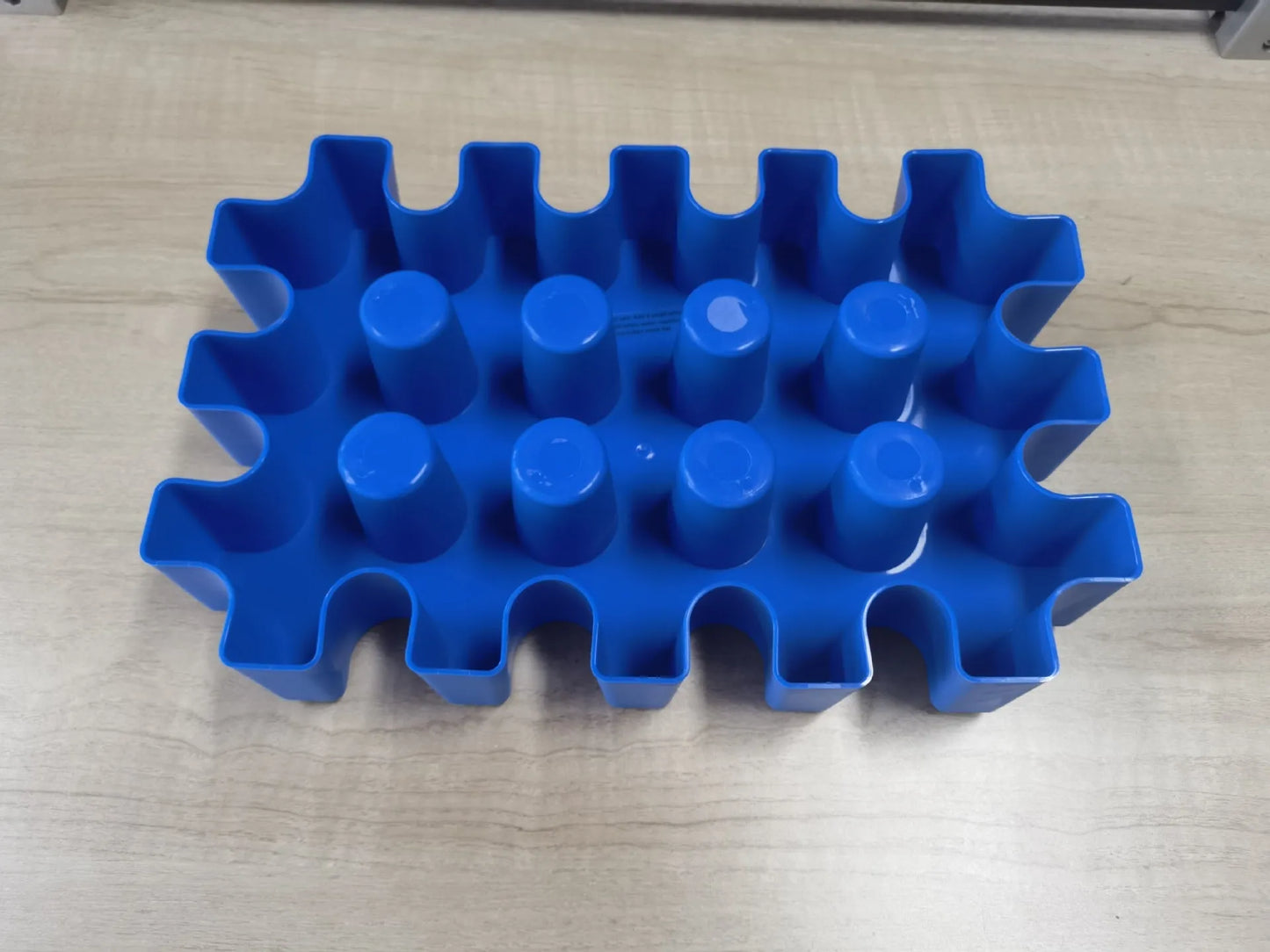 Blue plastic outdoor ice maker tray measuring 34cm long by 22cm wide
