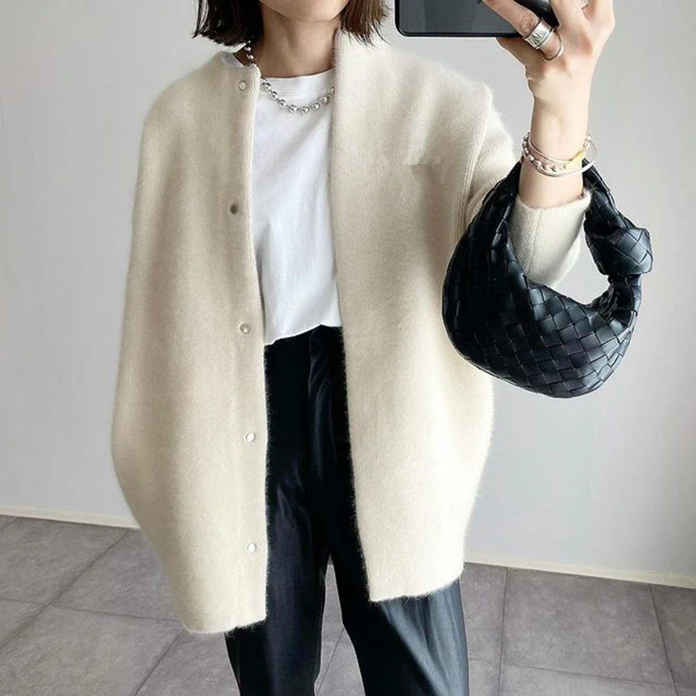 A cozy, knitted cardigan jacket in a variety of colors and sizes, featuring a relaxed open-front silhouette and premium construction for versatile layering.