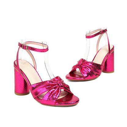 Gold high heel peep toe sandal with an adjustable buckle on the ankle strap.