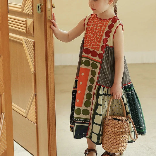 Sleeveless girls dress with abstract colour contrast patchwork pattern on cotton fabric