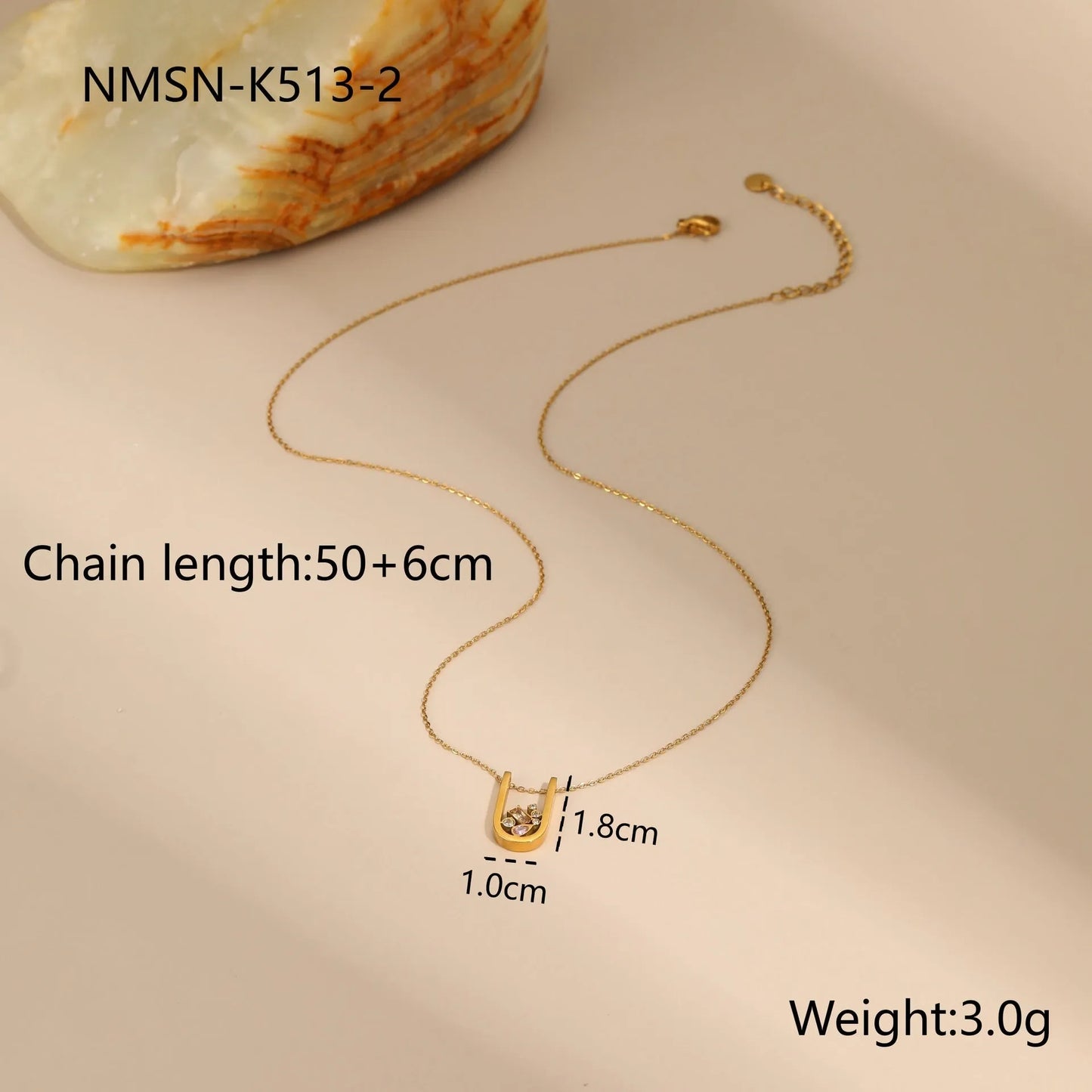 Geometric zircon jewellery set with gold-plated necklace, ring and earrings on stainless steel chain