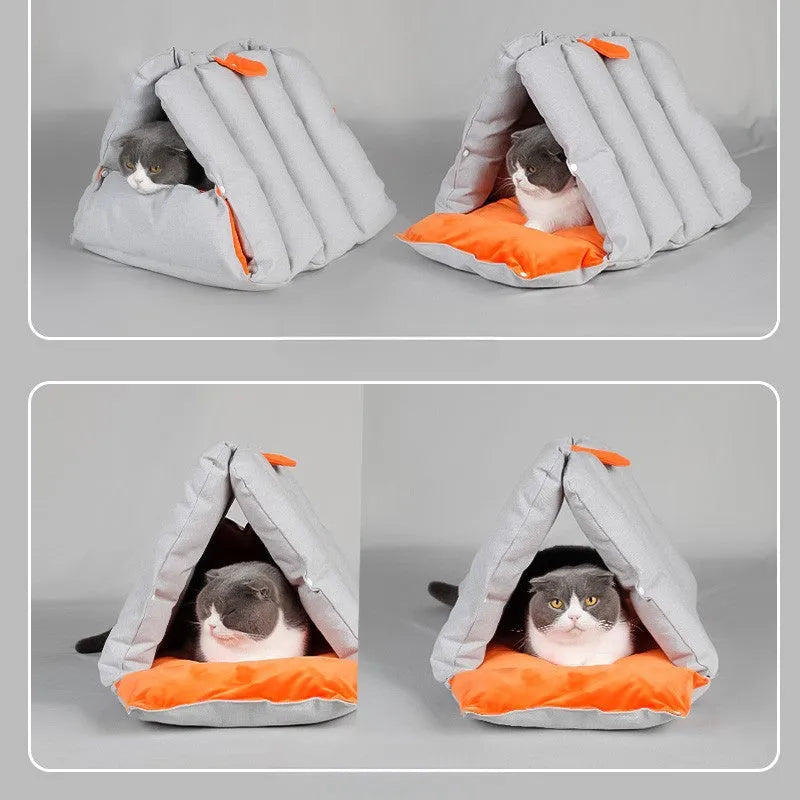Blue triangular cotton cat bed with a removable cover on a wooden floor.