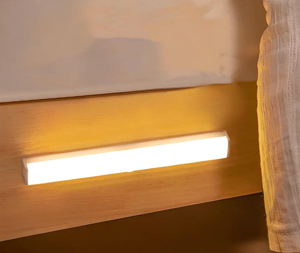 LED strip light with motion sensor in black finish, 30cm length with warm white illumination