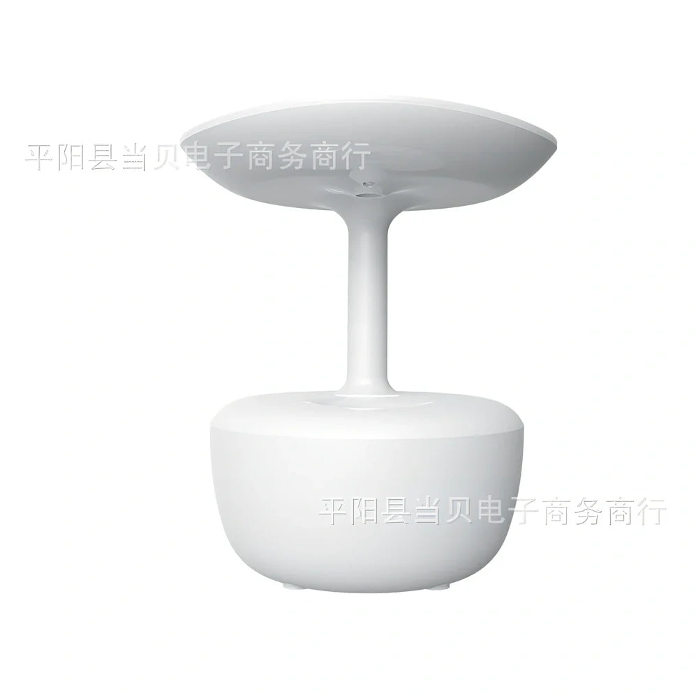 White lotus leaf shaped USB humidifier with mist output and LED illumination on wooden surface
