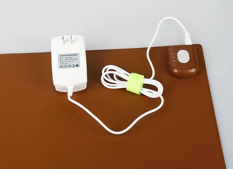 Two-stage Heating Desk Pad in black or pink, featuring quick warmth and waterproof design