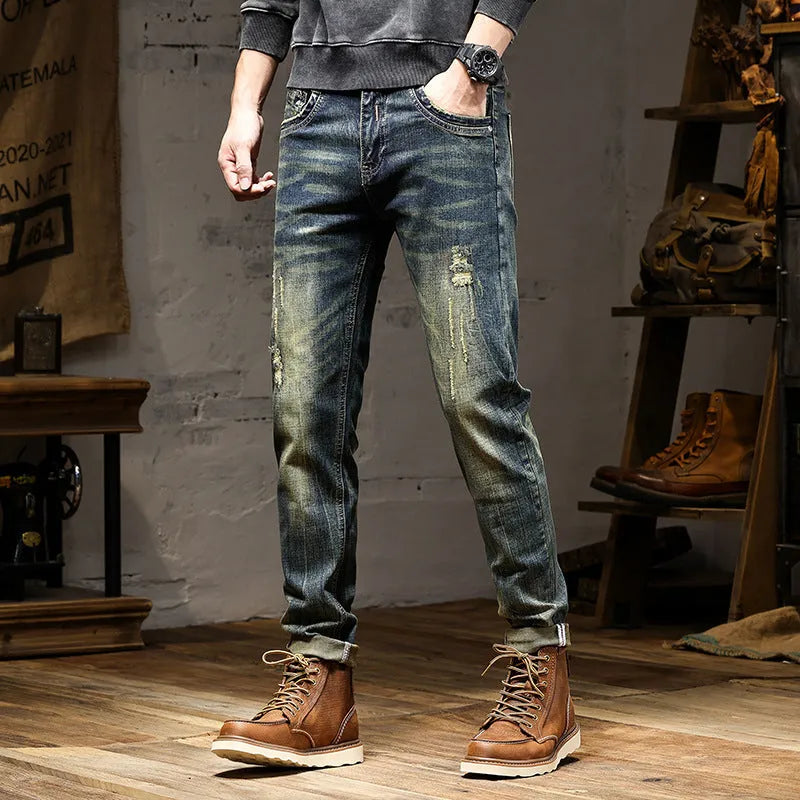 Men's skinny fit stretch denim jeans in retro colour with zip fly, shown in leisure setting.
