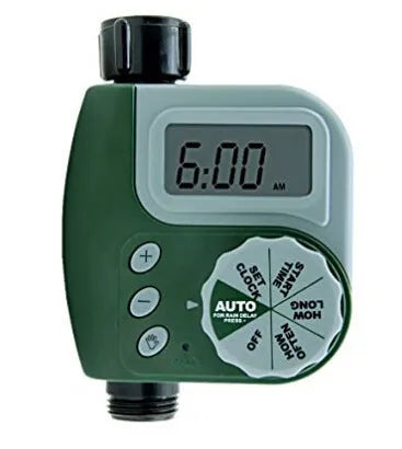 Green digital garden hose timer with LCD screen and dual hose outlets.