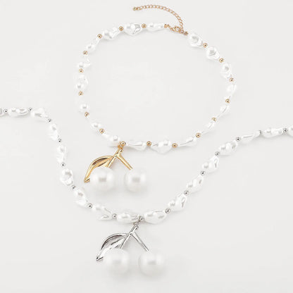 Adjustable 51-60cm alloy necklace with cherry fruit pendant and imitation pearls in gold or white K electroplated finish