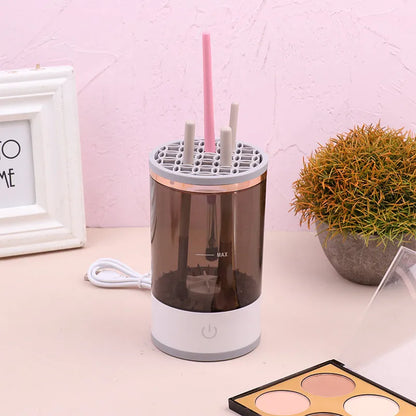 Grey and white portable electric makeup brush cleaner with USB charging cable.