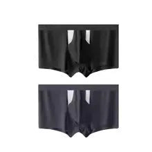 Man wearing black ice silk double-layer underwear shorts with a hole bag design for dry wet separation.