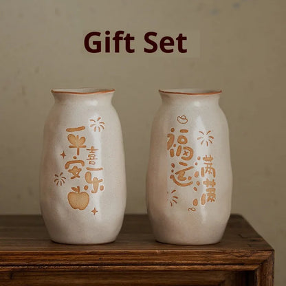 Hand-painted Chinese ceramic vase with carved detail on a desk, shown in Double Happiness colour design.