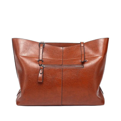 Leather cross-body handbag in Black colour with dimensions 30cm by 37cm by 13cm, showing internal pockets