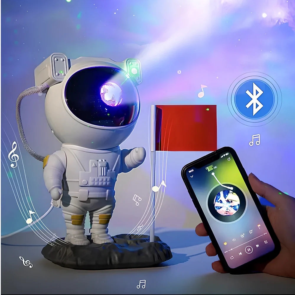 Astronaut-themed galaxy projector with adjustable nebula effects on table showing starry sky projection