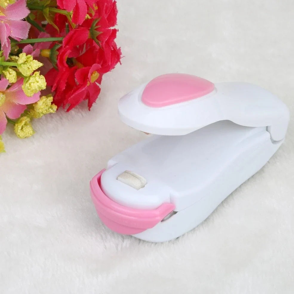 Mini hand pressure heat sealing machine measuring 10cm with magnetic base for plastic bag food preservation