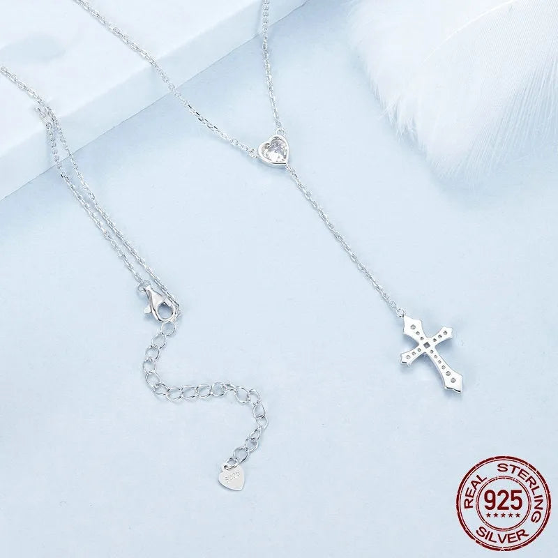Silver cross pendant necklace with V-neck design on O-ring chain