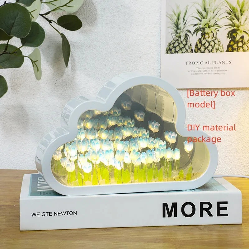DIY tulip-shaped night lamp kit with LED lights and mirror surface in assorted colours on a desk.