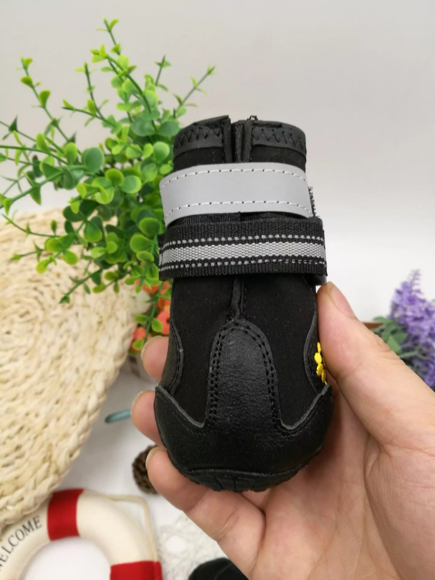 Black waterproof dog shoes with non-slip soles and adjustable fuzzy belts