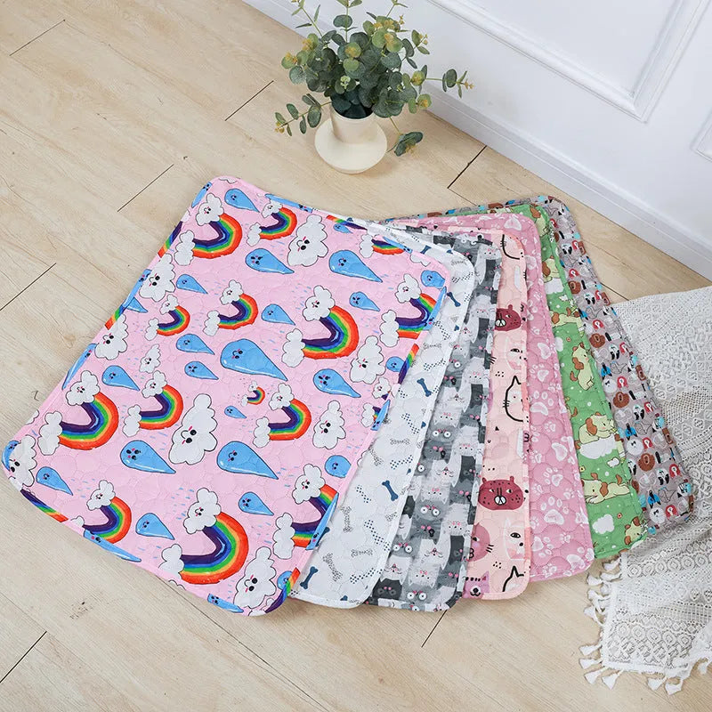 Reusable and washable pet urine pad overlay for dogs and cats with a non-slip waterproof backing and absorbent cloth top layer, available in 40x30, 50x40, 60x45, 70x50, and 90x70 cm sizes and seven fun animal-themed colour patterns.
