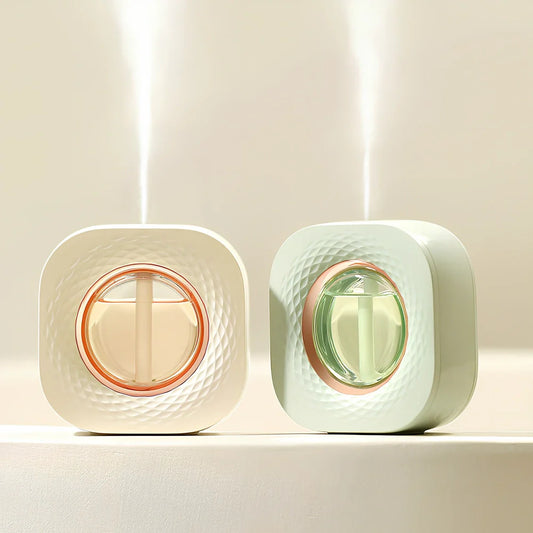 Square ivory white aroma diffuser with dry battery operation measuring 105x105x39mm