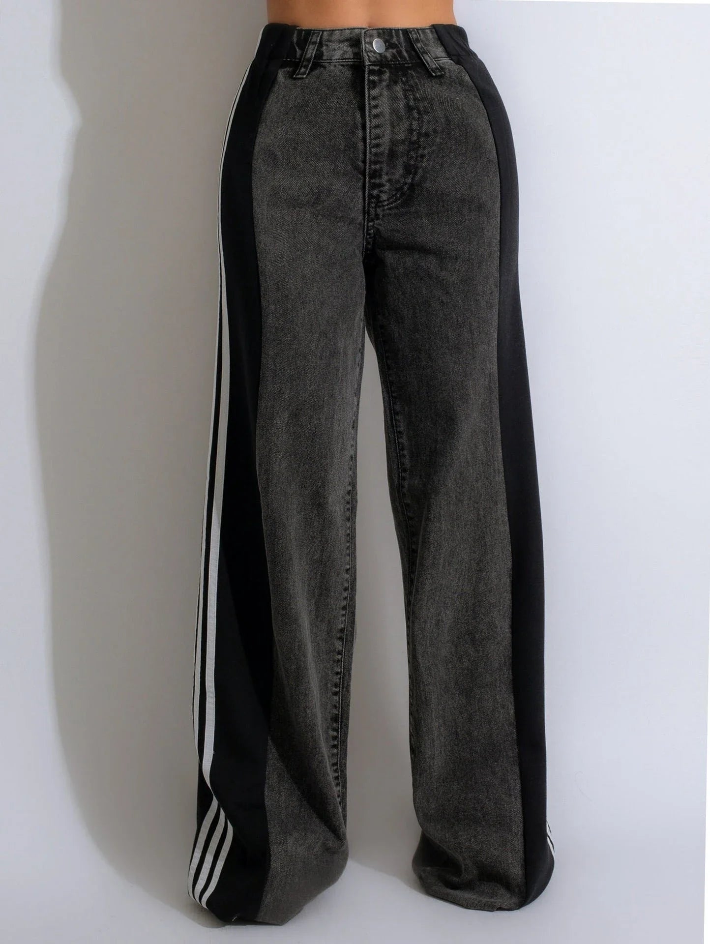 Stylish high-waist denim trousers with patchwork design, available in various color options