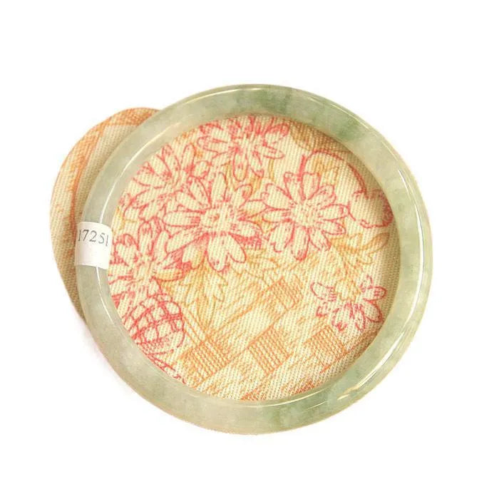 Green geometric jade waxy bracelet on a wrist, showing its 10mm thickness and Chinese style.