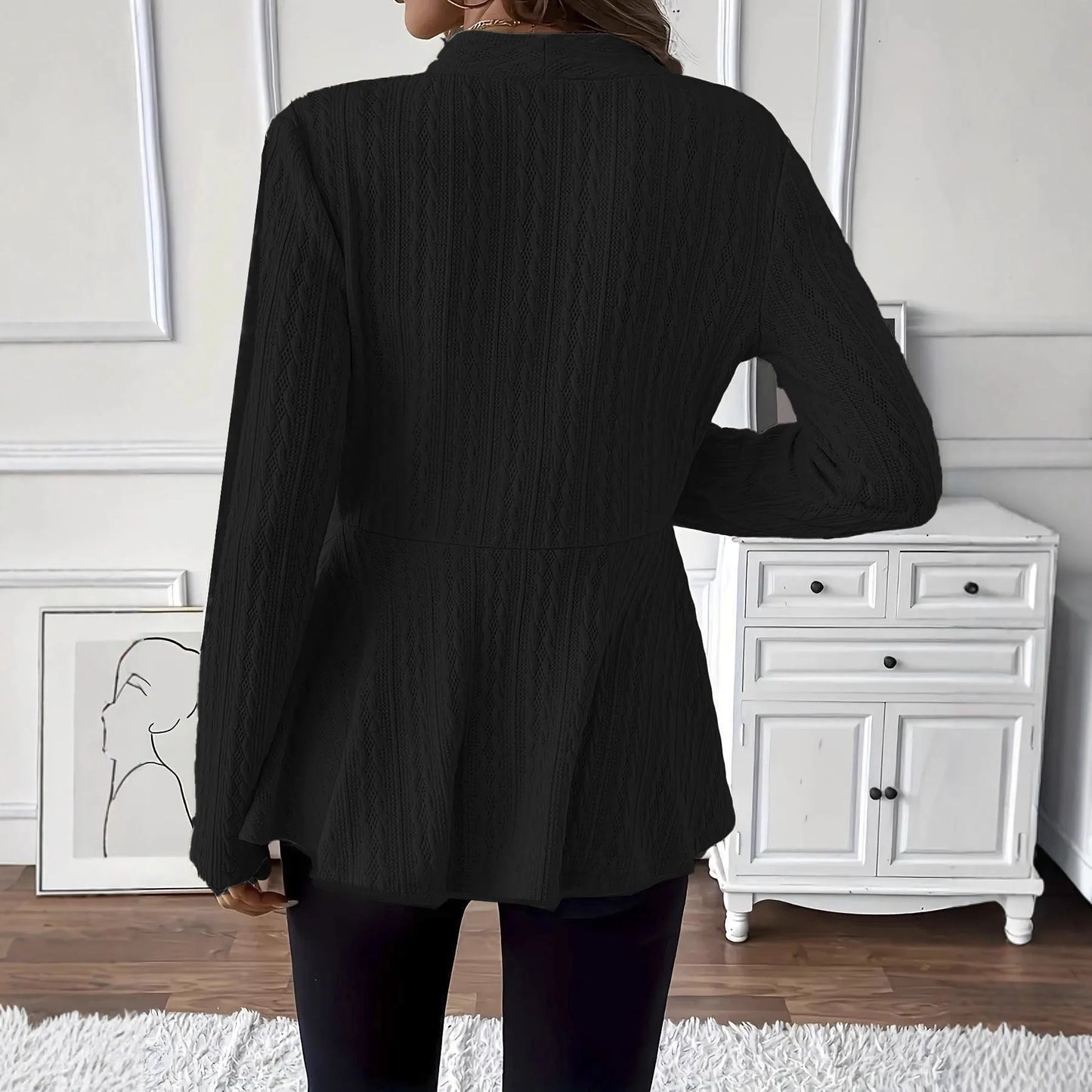 Women's apricot coloured knitted cardigan with jacquard pattern and one button front closure.
