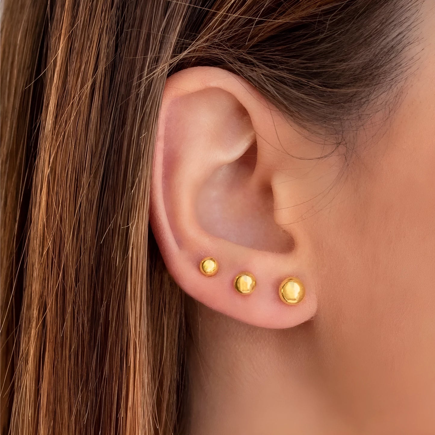 Stainless steel ball stud earrings with round geometric shape in gold or silver finish, sizes 3mm to 6mm