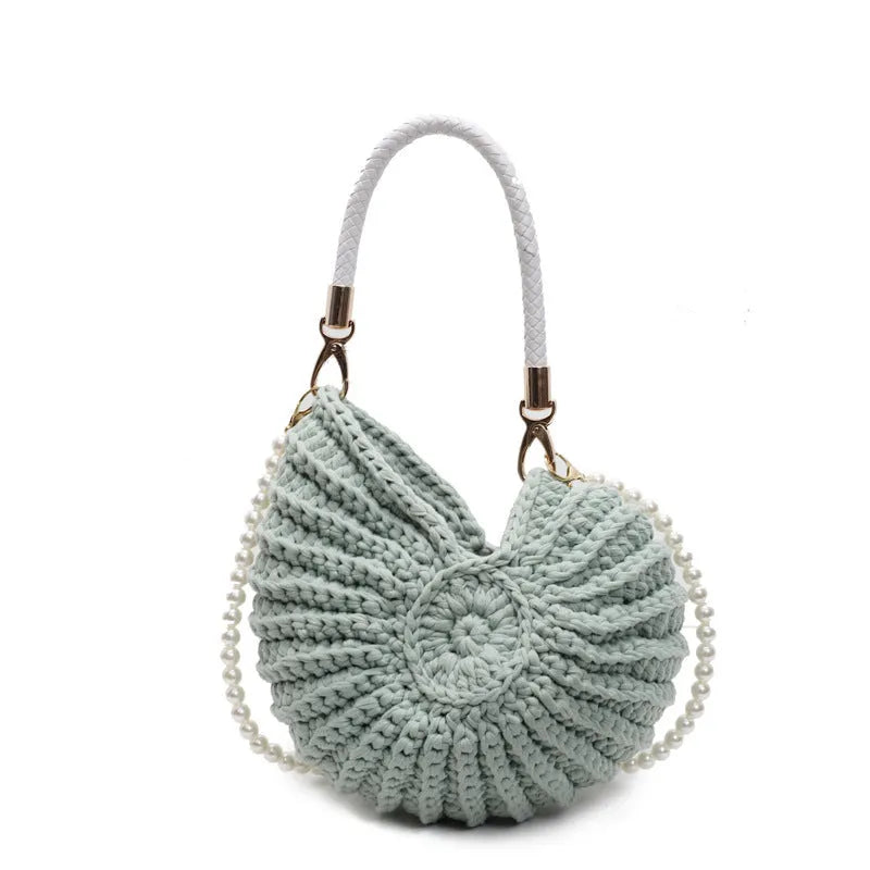 Handmade woven cloth bag with double shoulder straps in shell shape showing open pocket design