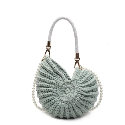 Handmade woven cloth bag with double shoulder straps in shell shape showing open pocket design