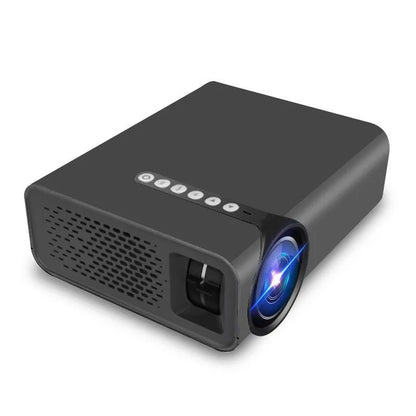 Black and white versions of the YG530 mini wireless mobile phone projector on a table.