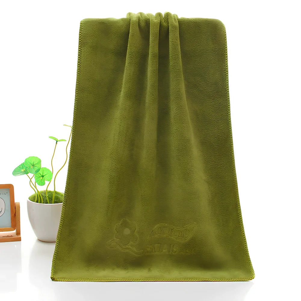 Blue microfiber towel with embossed texture measuring 70cm by 140cm with finished edges