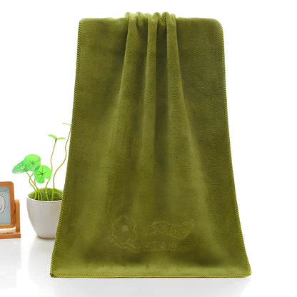 Blue microfiber towel with embossed texture measuring 70cm by 140cm with finished edges
