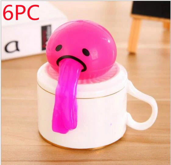 Gudetama Vomiting Egg Toy in green, orange, pink, and yellow for stress relief and fun