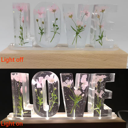 Wooden LOVE letter table lamp with dried flowers and warm LED light for bedroom use