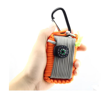 Hand-woven camping survival kit with 10.5m rope containing 25 tools including compass and medical supplies