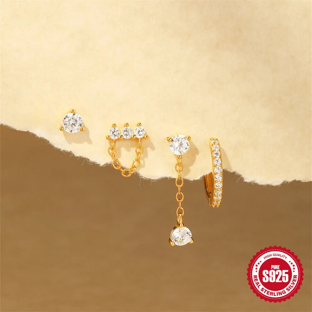 A pair of geometric clover petal stud earrings in gold-toned S925 sterling silver on a plain background.