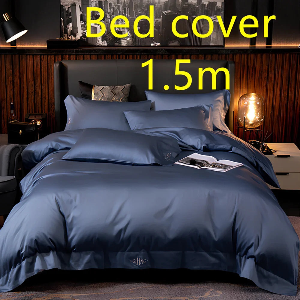 Four-piece quilted cotton bed set in royal blue, showing 200x230 cm cover and 48x74 cm pillowcases for 1.5m bed