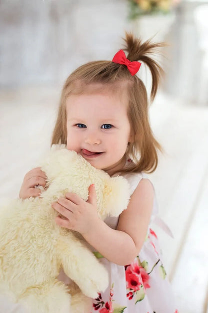 Multi-coloured assortment of 80 baby hair ties with grosgrain ribbon bows for infants and toddlers.