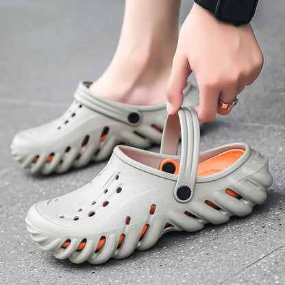 Men's beige slipper sandals with hollow-out design and textured non-slip sole, side view.
