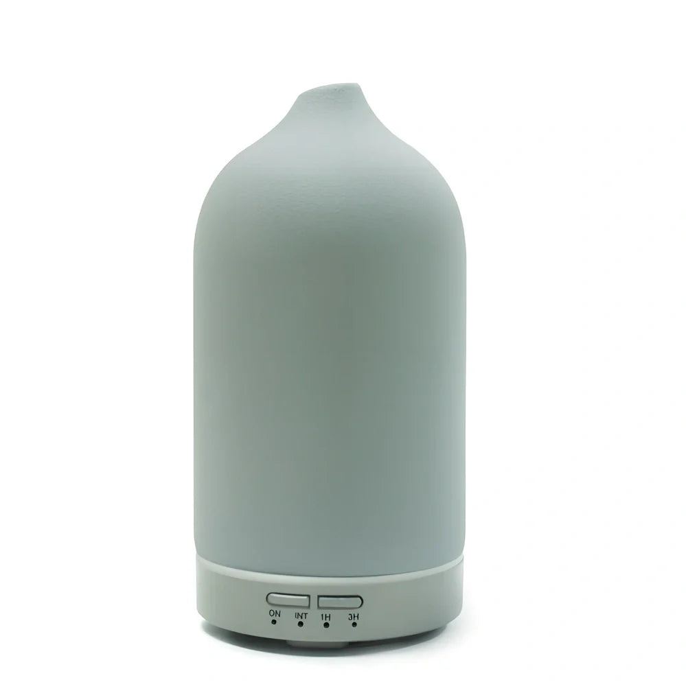 Ceramic ultrasonic aroma diffuser in white with 100ml tank, diffusing mist in home setting, 10cm diameter