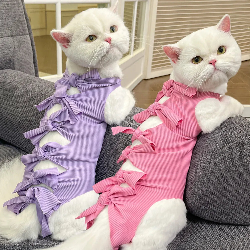 Lace-up cat sterilisation clothing in five colours including pink, purple, blue, brown, and green pineapple, showing adjustable fastening