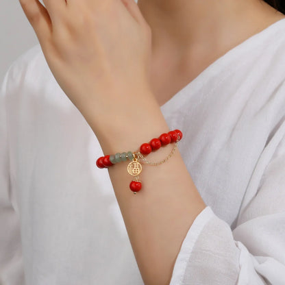 Retro red cinnabar fu character bracelet with jade beads and a long tassel