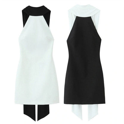 Slim-fitting black patchwork halter dress with asymmetric skirt and high waist detail