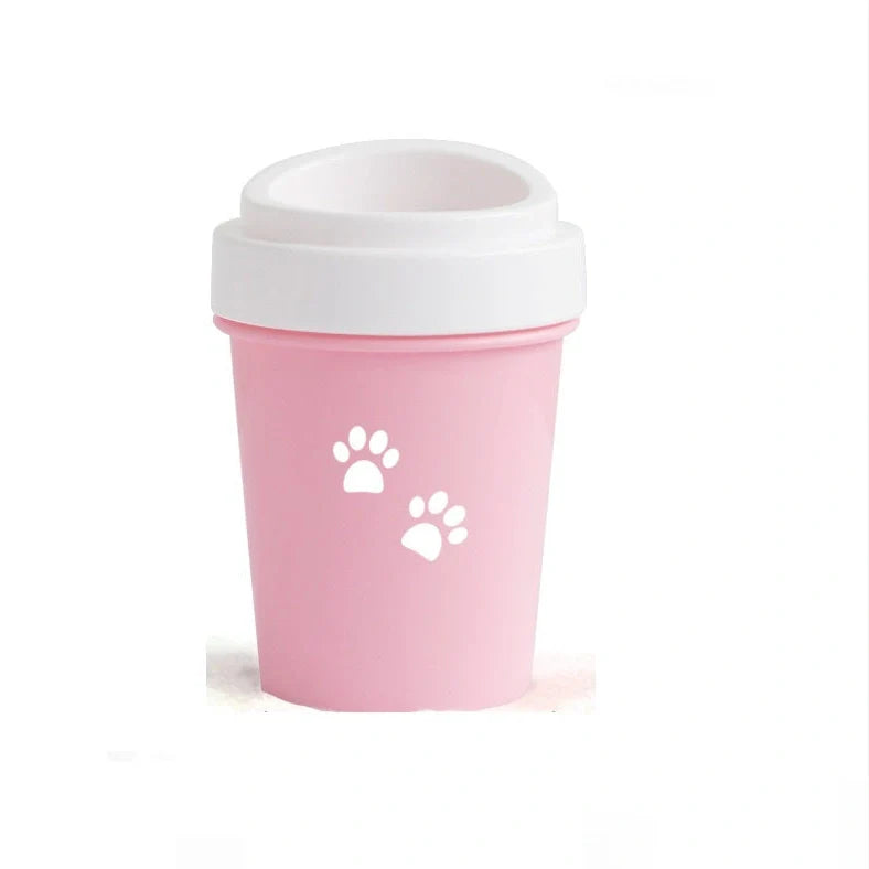 Silicone dog paw cleaner cup in blue, green, or pink with soft bristles for washing muddy paws